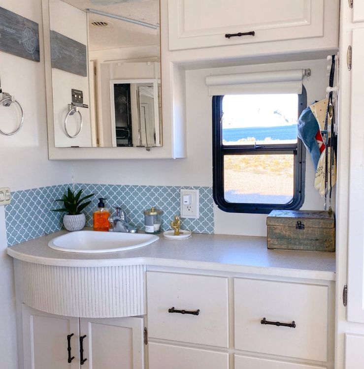 0100 Lady renovated this camper made it her full time home. Take a look inside smallhometours.com 10