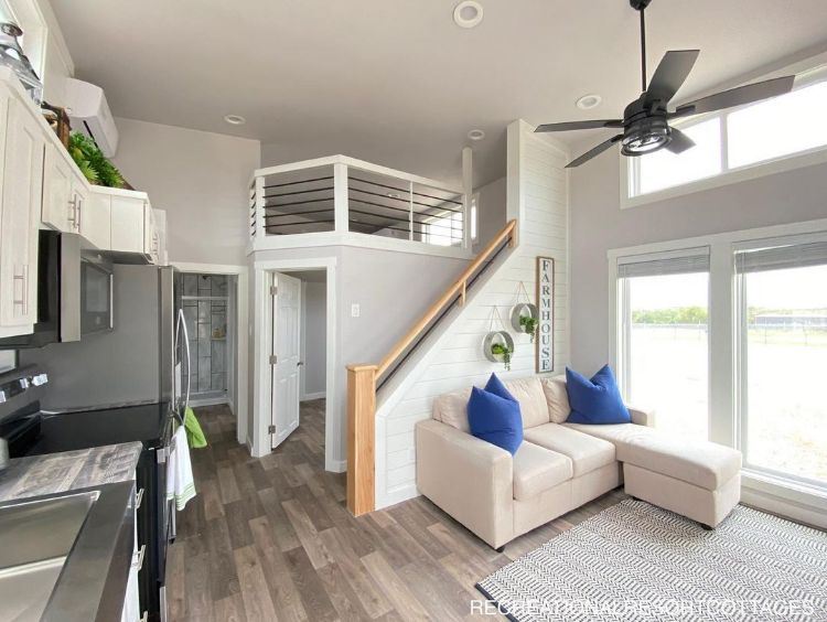 0118 Step inside this farmhouse style tiny home with an interior so luxurious youll forget youre in a RV 3