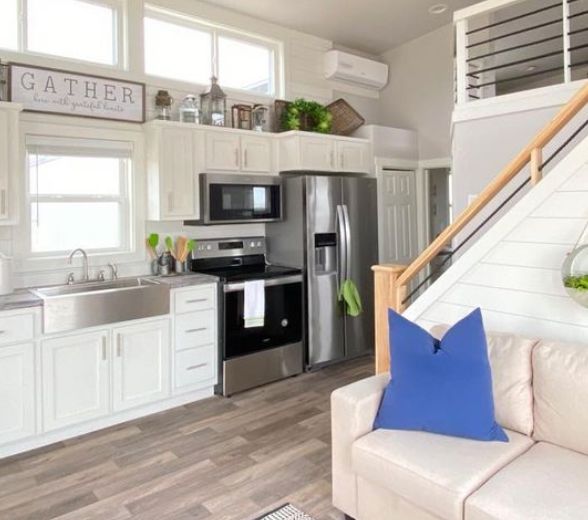 0118 Step inside this farmhouse style tiny home with an interior so luxurious youll forget youre in a RV 5