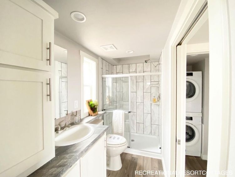 0118 Step inside this farmhouse style tiny home with an interior so luxurious youll forget youre in a RV 8