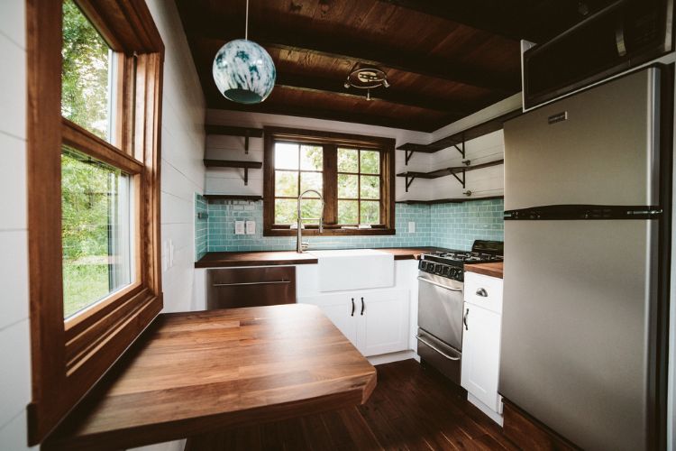 0126 Step through this stunning Dutch door to take a peek inside this tiny home smallhometours.com 4