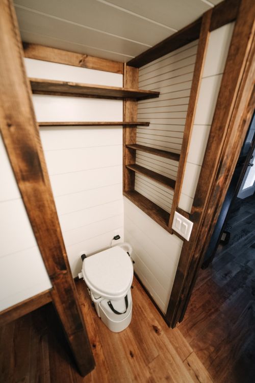 0133 Warm wooden accents and hand hewn details create farmhouse style in 330 square feet smallhometours.com 10