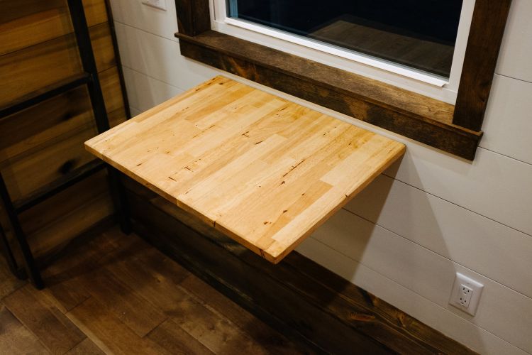 0133 Warm wooden accents and hand hewn details create farmhouse style in 330 square feet smallhometours.com 5