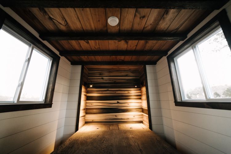 0133 Warm wooden accents and hand hewn details create farmhouse style in 330 square feet smallhometours.com 8