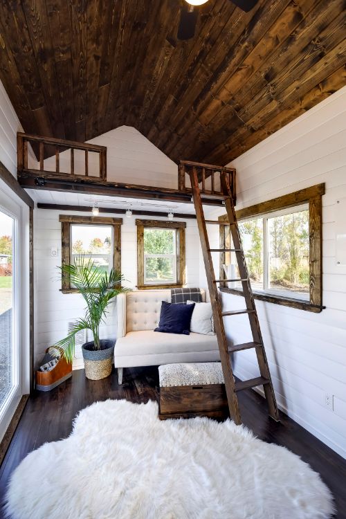 0140 White walls and cedar accents create a luxurious shell in this 26 foot tiny home smallhometours.com 3