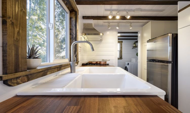 0140 White walls and cedar accents create a luxurious shell in this 26 foot tiny home smallhometours.com 5