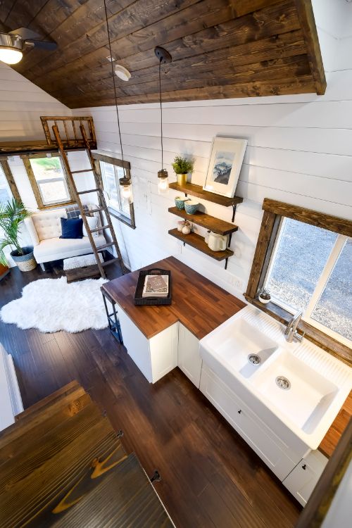 0140 White walls and cedar accents create a luxurious shell in this 26 foot tiny home smallhometours.com 8