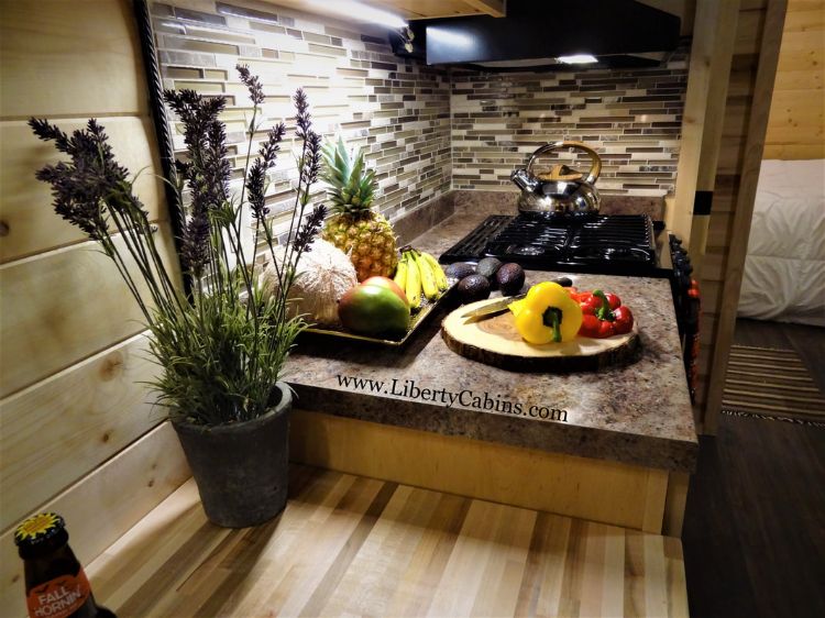 0153 Alpine vibes define this luxurious cabin packaged in an off the grid RV smallhometours.com 4
