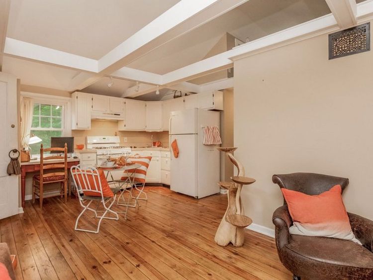 0163 Peek inside this tiny cottage youll love the rustic hardwood floors smallhometours.com 3