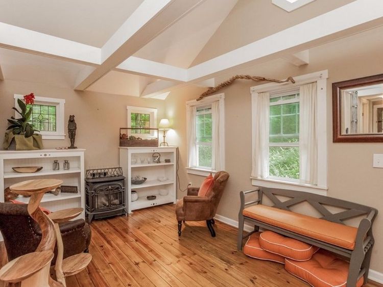 0163 Peek inside this tiny cottage youll love the rustic hardwood floors smallhometours.com 4