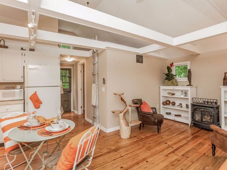 0163 Peek inside this tiny cottage youll love the rustic hardwood floors smallhometours.com 5