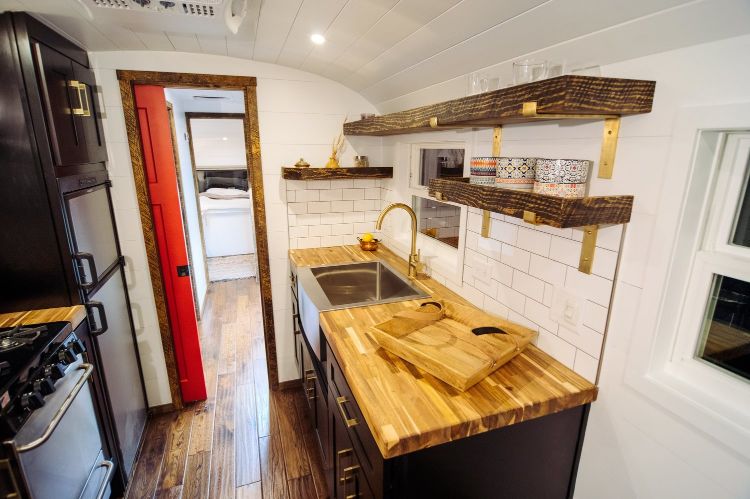 0166 A 12 inch roof raise elevates this luxurious custom Skoolie literally smallhometours.com 3