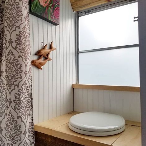 0168 This couple lives full time in a renovated Skoolie with their large family of fur babies smallhometours.com 4