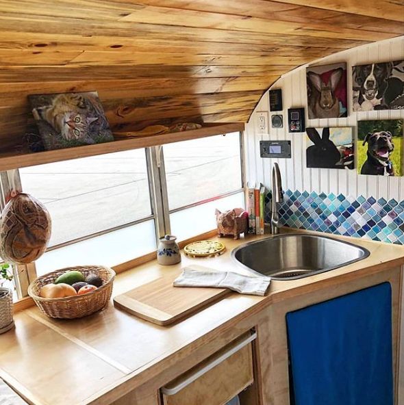 0168 This couple lives full time in a renovated Skoolie with their large family of fur babies smallhometours.com 6