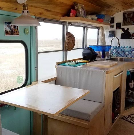 0168 This couple lives full time in a renovated Skoolie with their large family of fur babies smallhometours.com 7
