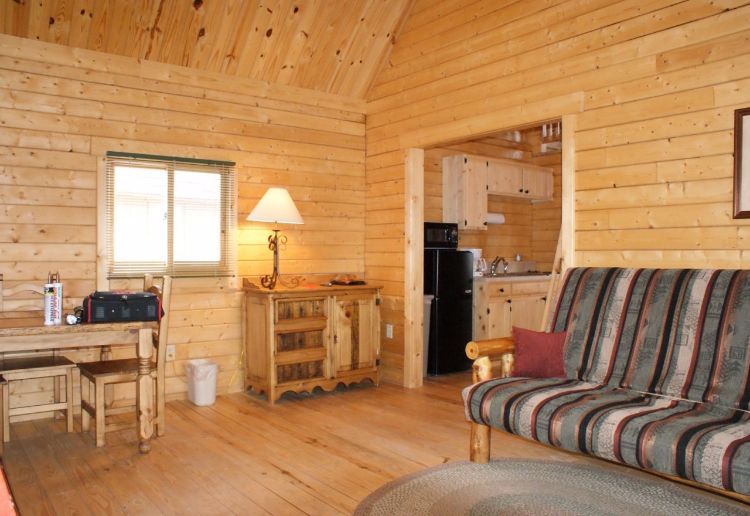 0186 Peek inside The interior of this simple log cabin is perfection smallhometours.com 2
