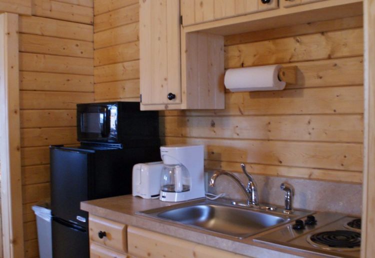 0186 Peek inside The interior of this simple log cabin is perfection smallhometours.com 3