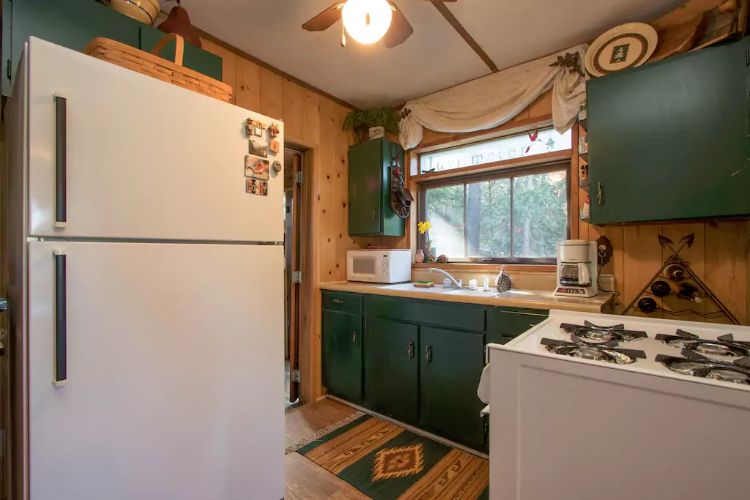 0194 Tour a unique log cabin – youll fall in love the impressive master suite within smallhometours.com 4