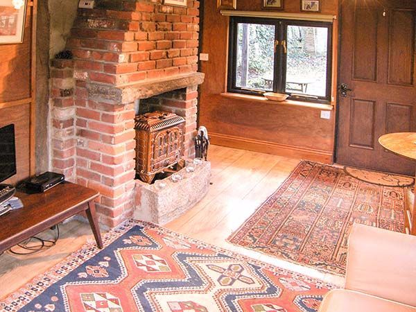 0197 Explore this cozy cabin – youll love the old fashioned fireplace smallhometours.com 2