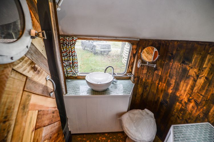 0205 70s style meets modern convenience in this remodeled Airstream Overlander smallhometours.com 7