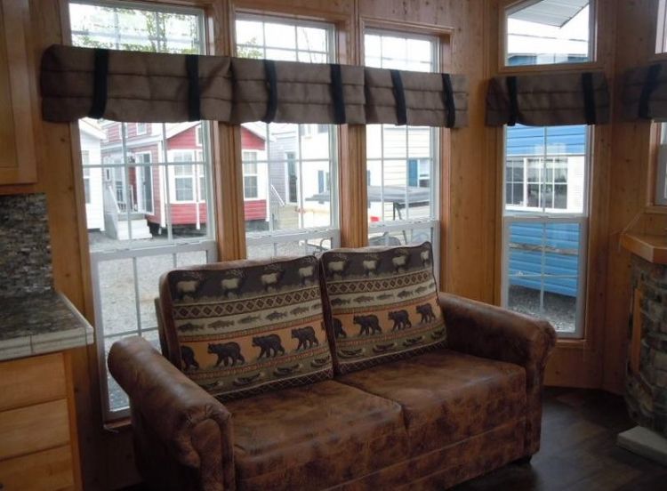 0214 Become enchanted with the rich rustic tones of this park models interior smallhometours.com 2