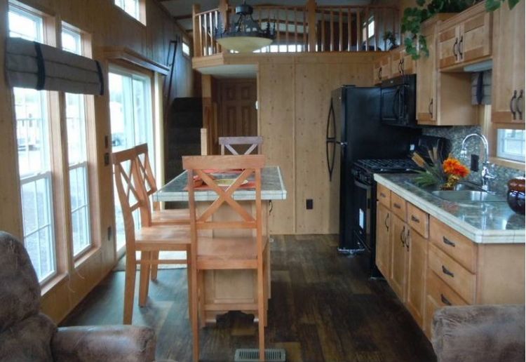 0214 Become enchanted with the rich rustic tones of this park models interior smallhometours.com 4