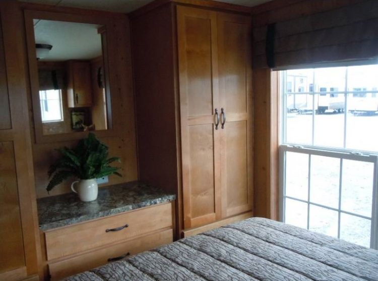 0214 Become enchanted with the rich rustic tones of this park models interior smallhometours.com 9