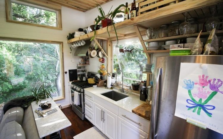 0222 Marvel at the gorgeous ceilings and ultra functional kitchen in this luxurious park model smallhometours.com 3