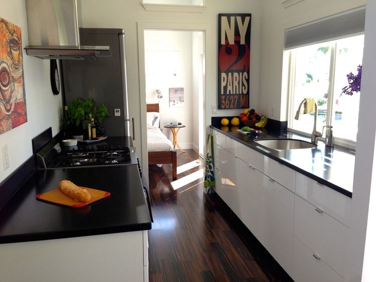 0225 Take a peek at a top of the line model with a kitchen thats as sleek as they get smallhometours.com 4