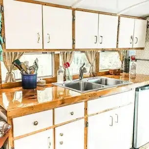 0232 Couple turns prison bus into a perfectly designed DIY skoolie smallhometours.com 6