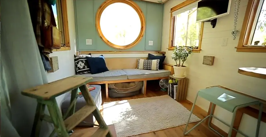 0253 Tiny house with reclaimed materials bathroom penny floor smallhometours.com 9
