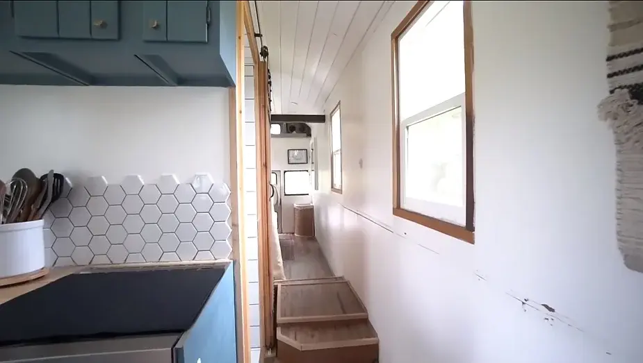 0286 Raised roof school bus conversion to tiny house DIY elevator bed smallhometours.com 1