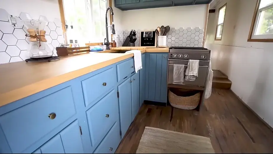 0286 Raised roof school bus conversion to tiny house DIY elevator bed smallhometours.com 2