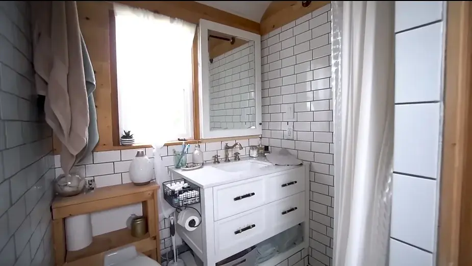 0286 Raised roof school bus conversion to tiny house DIY elevator bed smallhometours.com 4