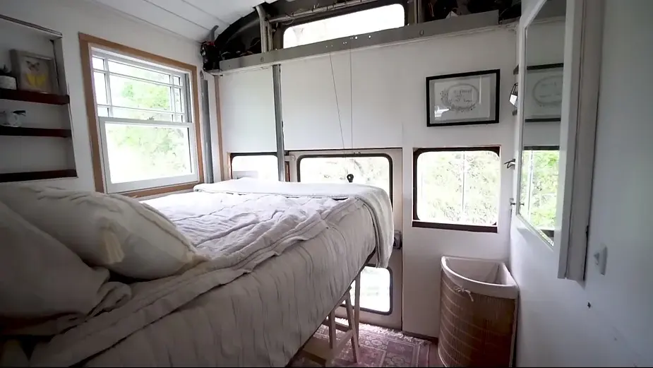 0286 Raised roof school bus conversion to tiny house DIY elevator bed smallhometours.com 5