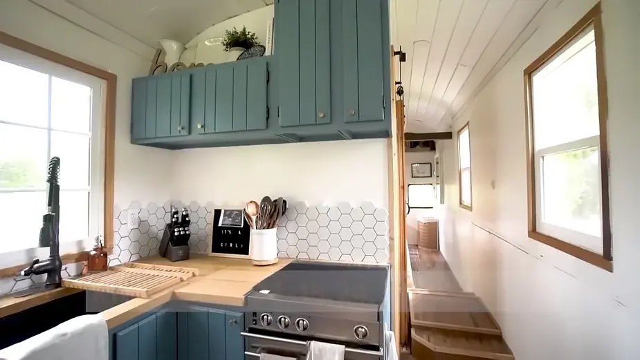 0286 Raised roof school bus conversion to tiny house DIY elevator bed smallhometours.com 8