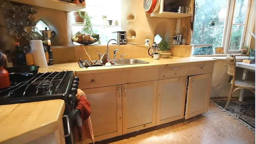 0309 A fantastic DIY cobb tiny house built with earth reclaimed materials smallhometours.com 5
