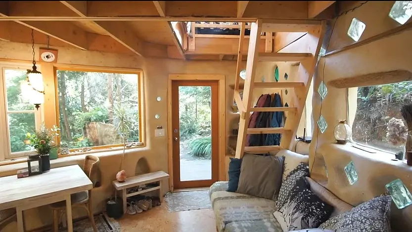 0309 A fantastic DIY cobb tiny house built with earth reclaimed materials smallhometours.com 7