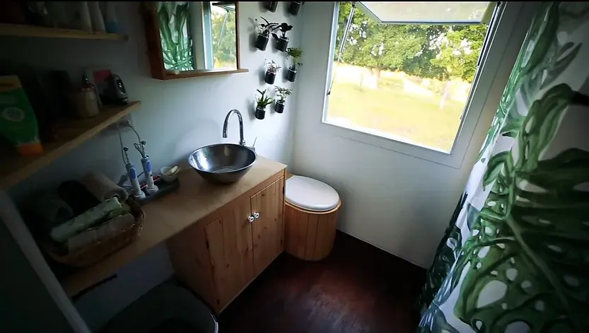 0321 Amazing tiny house with solar hot water solar electricity biogas and rainwater collection smallhometours.com 10