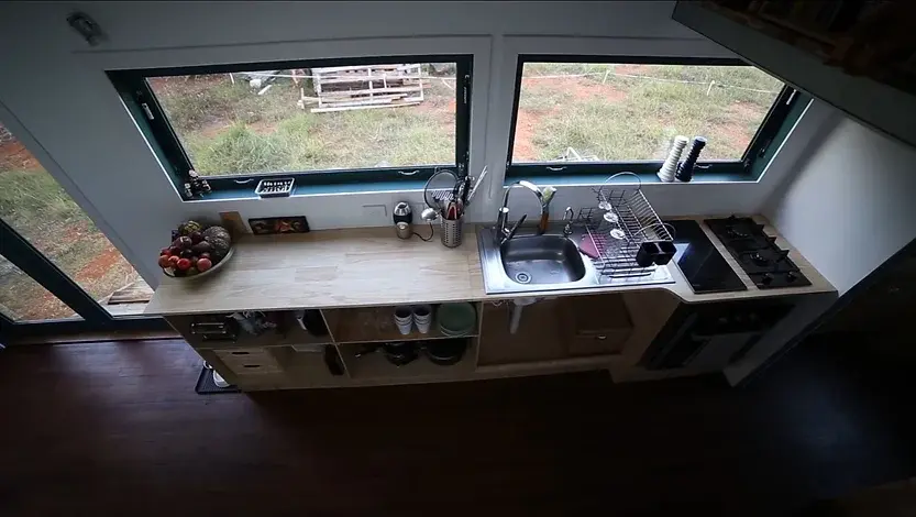 0321 Amazing tiny house with solar hot water solar electricity biogas and rainwater collection smallhometours.com 2