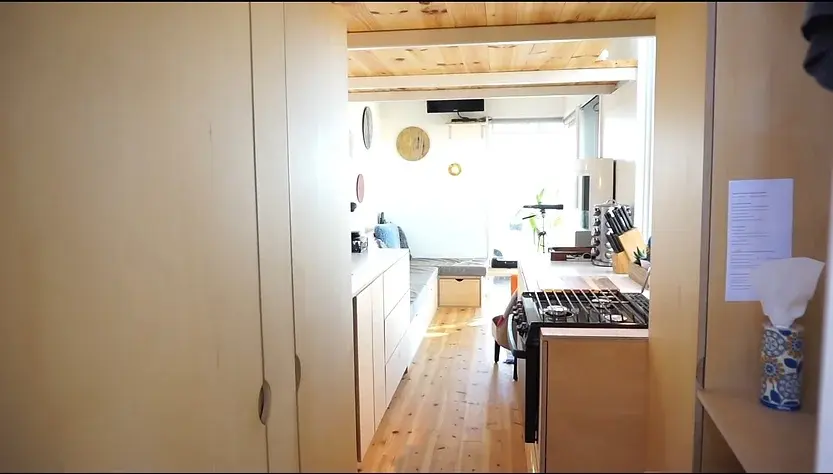 0327 210 sqft tiny house with space saving hidden bathroom smallhometours.com 1