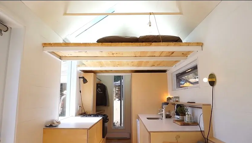 0327 210 sqft tiny house with space saving hidden bathroom smallhometours.com 3