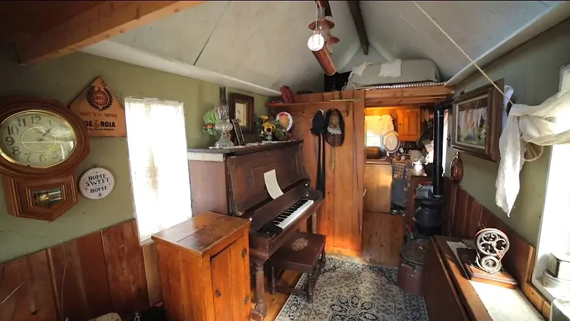 0336 Victorian tiny house 19th century living pitcher pump fresh water double duty piano smallhometours.com 4