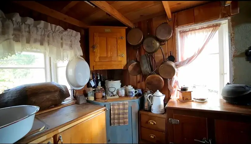 0336 Victorian tiny house 19th century living pitcher pump fresh water double duty piano smallhometours.com 5