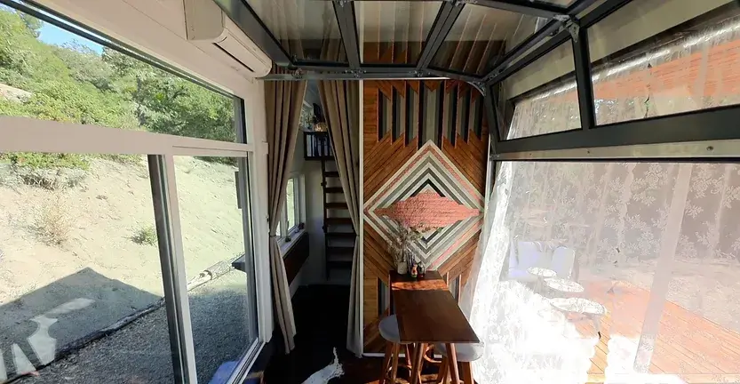 0340 Couple build luxury tiny house with a huge dining table up for 12 people smallhometours.com 2