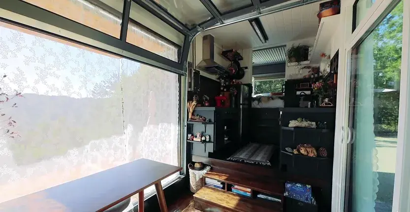 0340 Couple build luxury tiny house with a huge dining table up for 12 people smallhometours.com 3