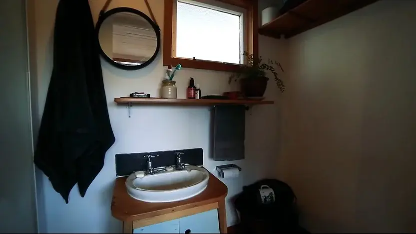 0342 Young woman build beautiful recycled tiny house from earthquake damaged homes for US19000 smallhometours.com 1