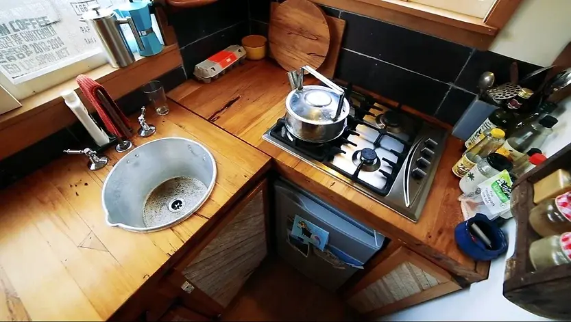 0342 Young woman build beautiful recycled tiny house from earthquake damaged homes for US19000 smallhometours.com 4