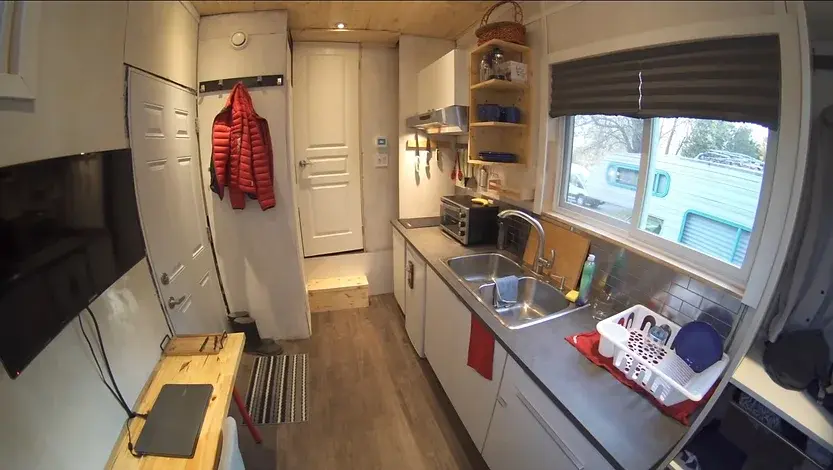 0353 DIY tiny house with clever elevator bed build by young man super cheap smallhometours.com 2