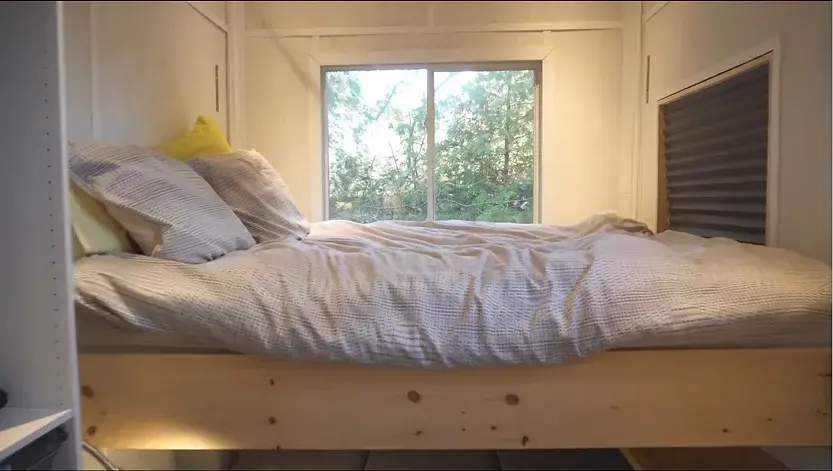 0353 DIY tiny house with clever elevator bed build by young man super cheap smallhometours.com 4